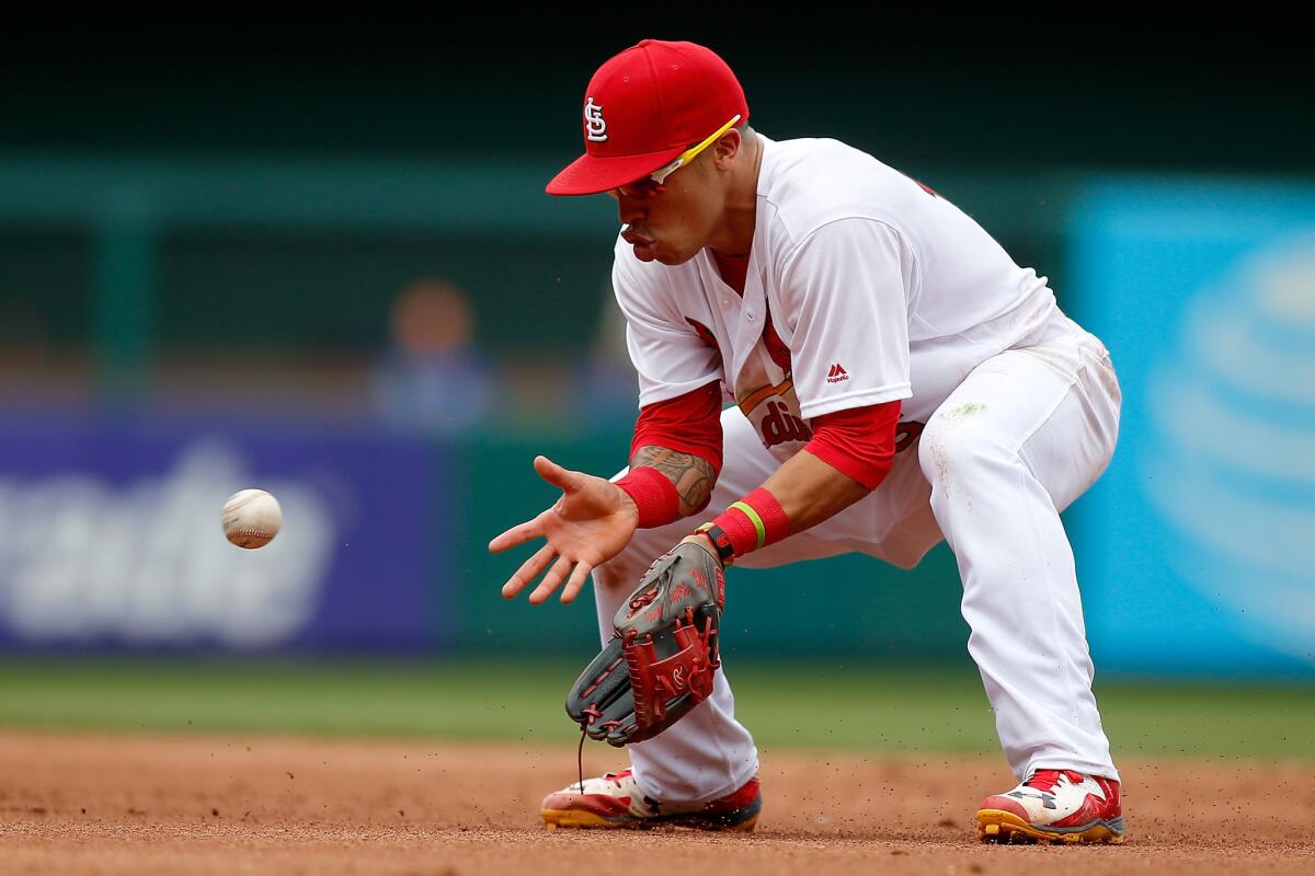 Cardinals second baseman Kolten Wong (16) makes a play during the fifth inning of a game against the Cubs on May 25.