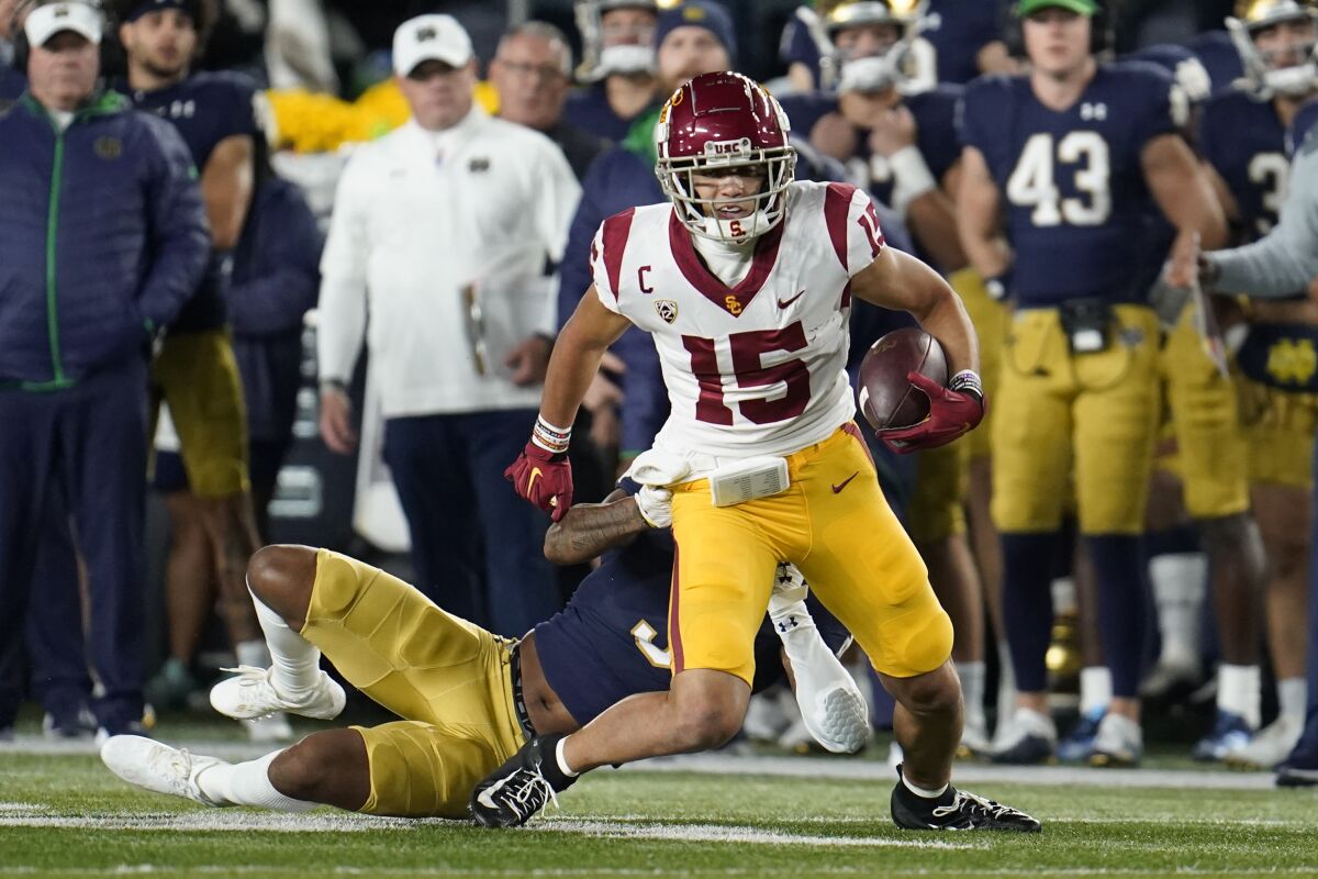 USC receiver Drake London pulls away from Notre Dame safety Houston Griffith 