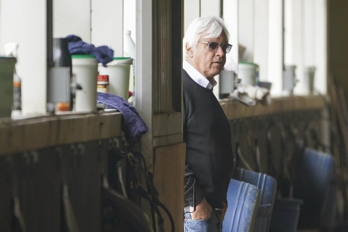 Trainer Bob Baffert surveys the stables as workouts continue at Belmont Park on Friday.