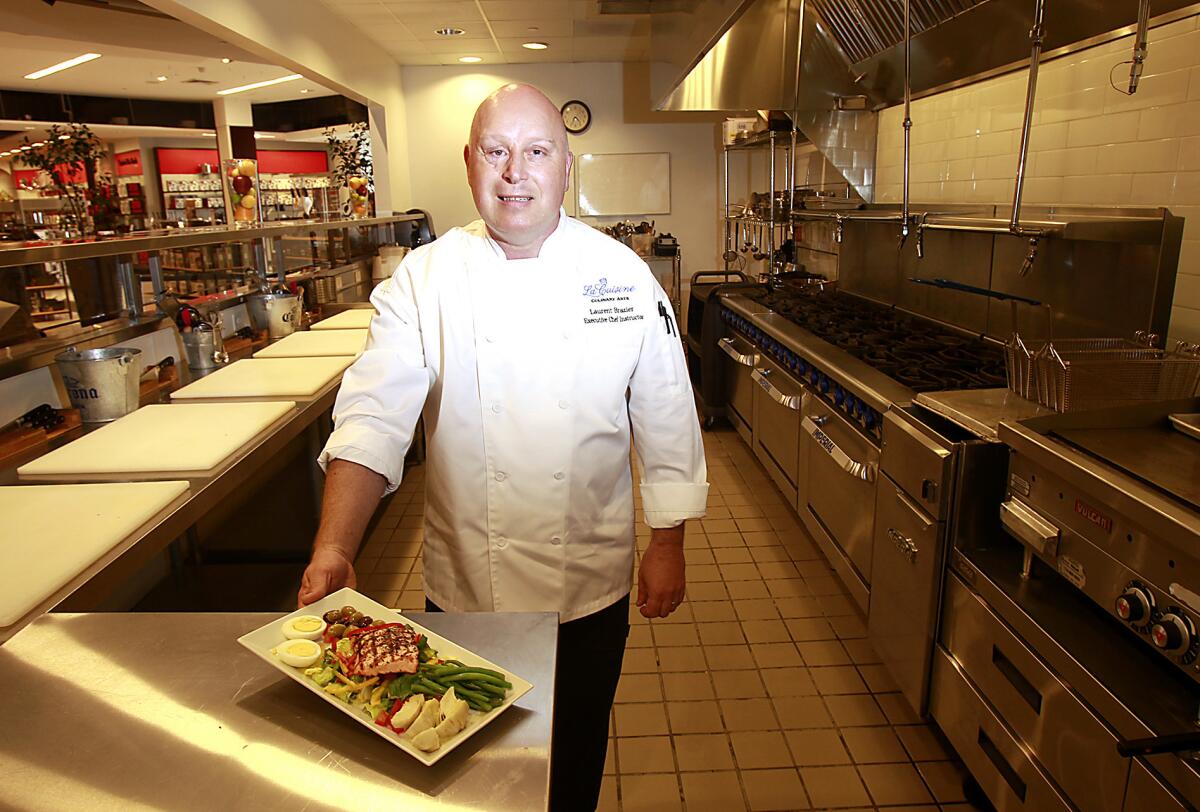 Executive Chef Laurent Brazier stands in the kitchen at La Cuisine Culinary Arts in the Macy's Home Store of South Coast Plaza.