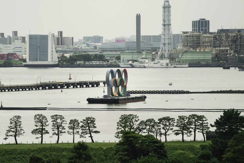 The large Olympic rings are displayed in the Odaiba section of Tokyo ahead of the 2020 Summer Olympics, Wednesday, July 14, 2021. (AP Photo/Jae C. Hong)