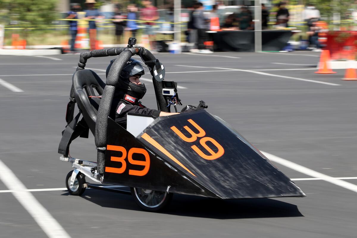 Huntington Beach's Kirin Kunkle, 17, drives through a turn during the Energy Invitational at UC Irvine on Saturday.