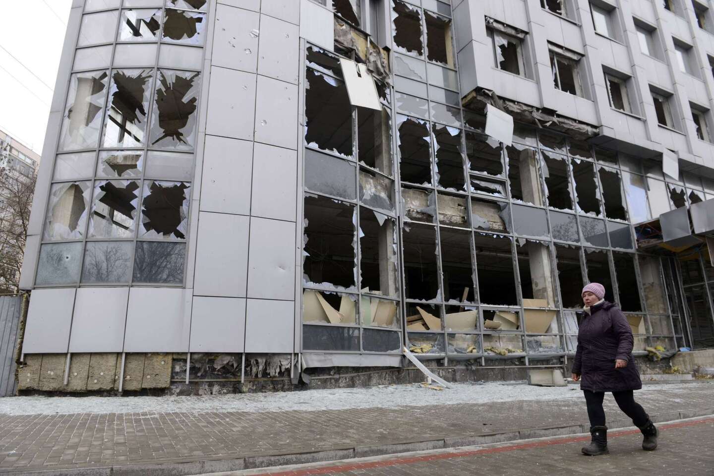 A lone pedestrian passes through a once-bustling area of Donetsk on Nov. 13. Commercial buildings, government offices and thousands of homes have been destroyed in the city in seven months of fighting between separatists and Ukrainian troops.