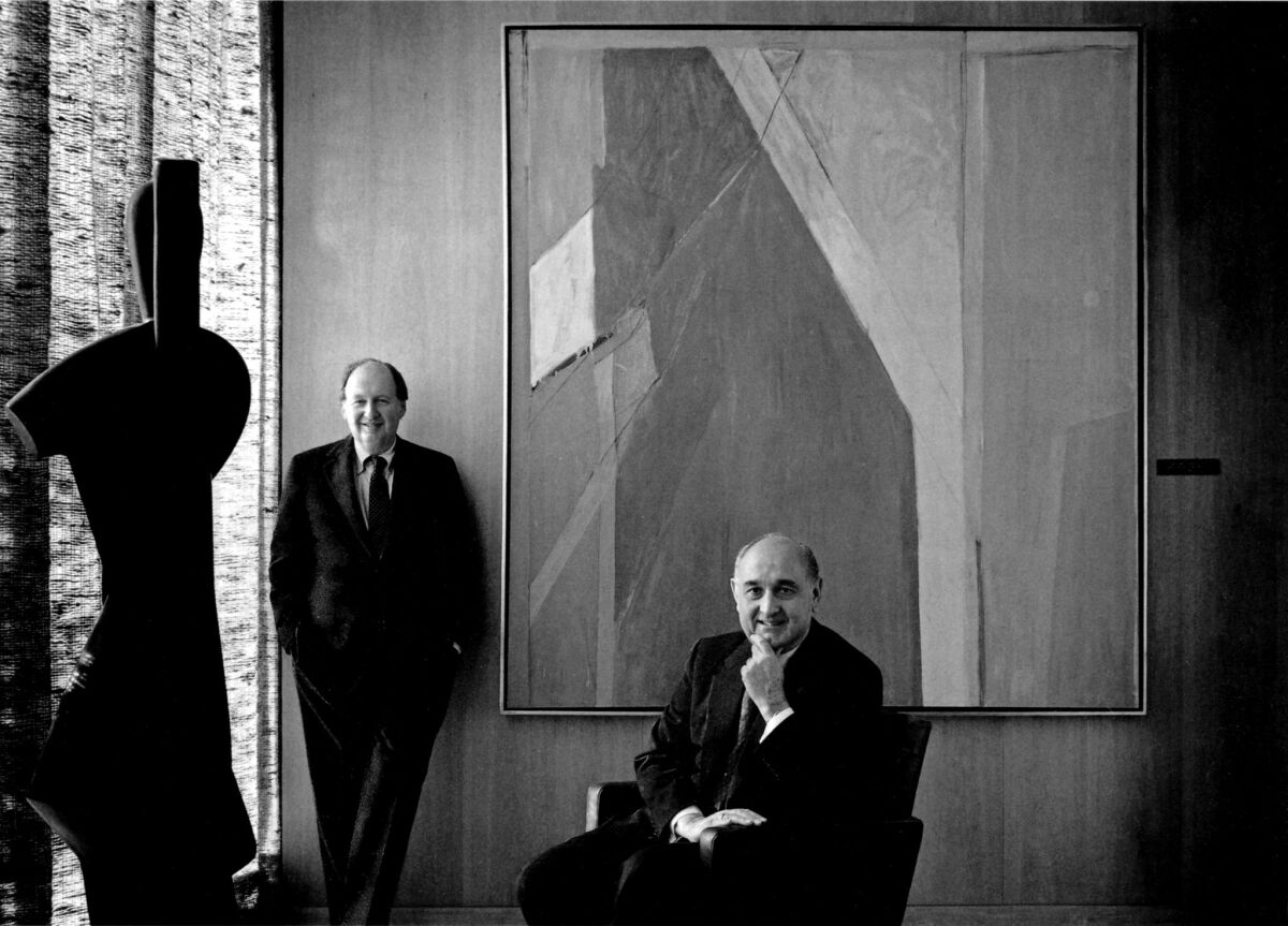 David Laventhol, former Times publisher, left, and Robert F. Erburu, chief executive of Times Mirror, are shown with Alexander Archipenko's sculpture, “Gondolier,” left, and Richard Diebenkorn’s painting, “Ocean Park No. 9,” in 1992.