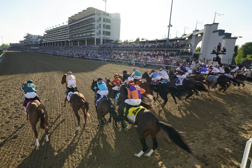 The field of 19 horses bolt out of the starting gate during the 2021 Kentucky Derby at Churchill Downs in Louisville, Ky.