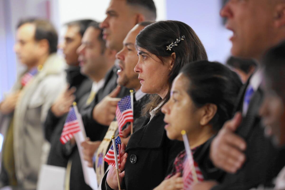 Immigrants take oath of citizenship to the United States on Nov. 20 in Newark, N.J.