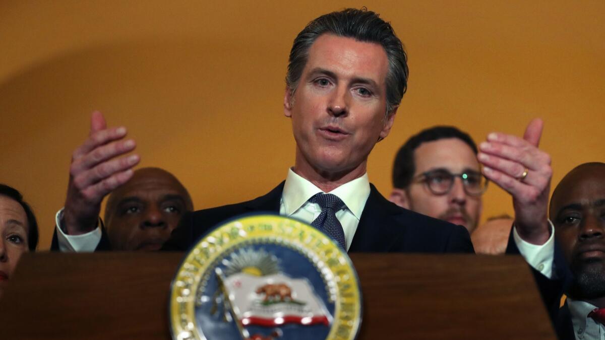 Gov. Gavin Newsom speaks at a news conference in Sacramento on March 13 about his moratorium on the death penalty in California.