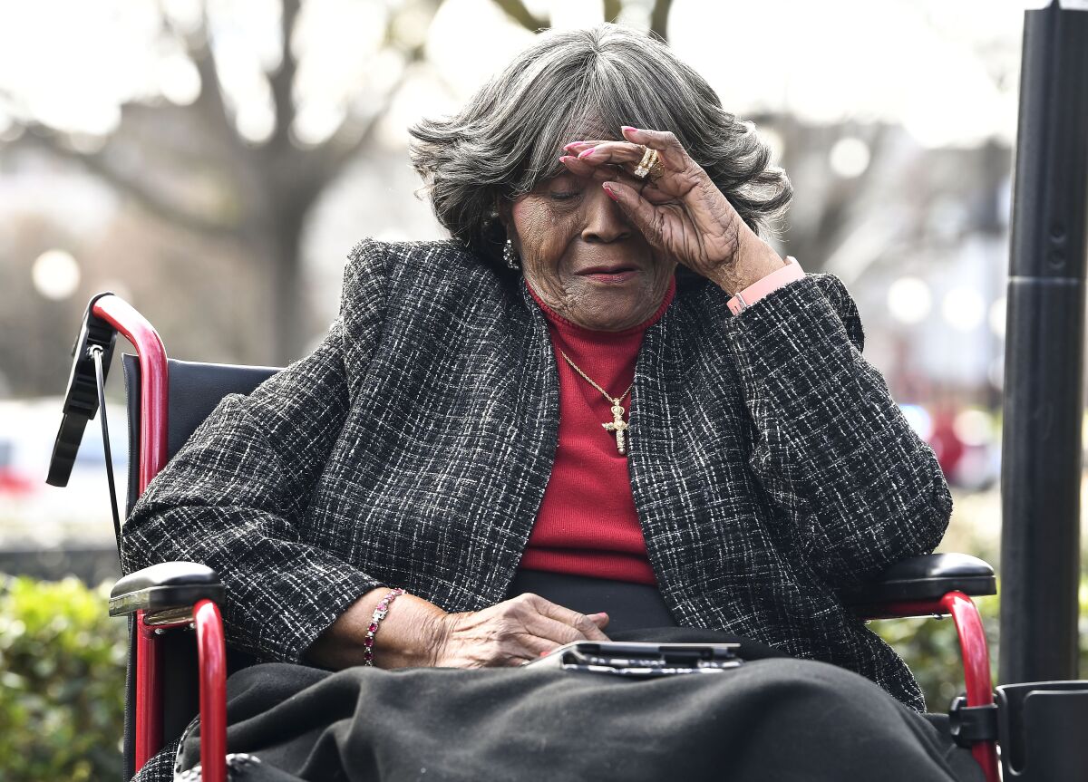 FILE - Autherine Lucy Foster reacts during the dedication ceremony for Autherine Lucy Foster Hall in Tuscaloosa, Ala., Friday, Feb. 25, 2022. Angela Foster Dickerson, Foster's daughter, says her mother died Wednesday, March 2, 2022 and said a family statement would be released. (Gary Cosby Jr./The Tuscaloosa News via AP, File)