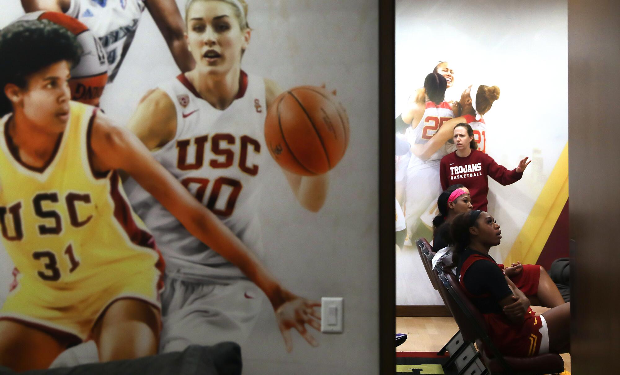 USC women's basketball head coach Lindsay Gottlieb watches film with her team.