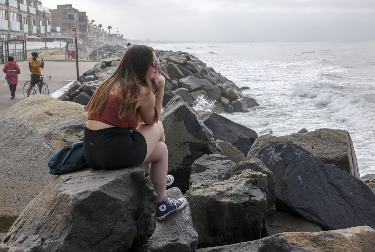 Rebecca Wilson, 19, a Colorado State University student visiting Oceanside for spring break, along The Strand on March 16.