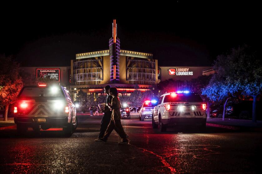 Movie-goers evacuate the Century Rio movie theater as officers respond to a shooting at the theater located at 4901 Pan American freeway in northeast Albuquerque, N.M., on Sunday, June 25, 2023. The Albuquerque Police Department said Monday that an argument over seat reservations escalated into a shooting that left a 52-year-old man dead and sent filmgoers scrambling for cover. Homicide charges were filed Monday against a 19-year-old who was wounded in the Sunday-night confrontation. (Chancey Bush/The Albuquerque Journal via AP)