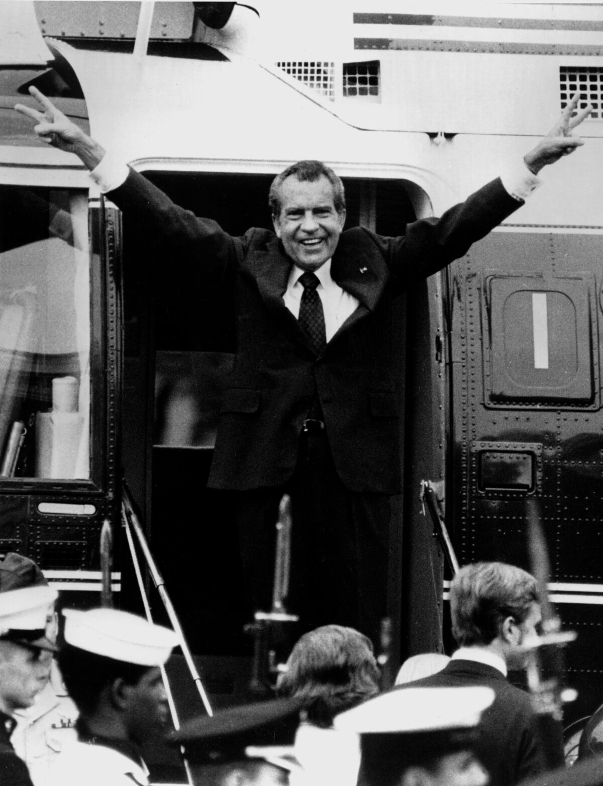 Richard Nixon gives a victorious salute after resigning the presidency on Aug. 9, 1974. His resignation led to reforms.