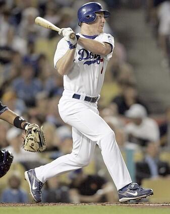 Dodgers J.D. Drew hits a double in the first inning to bring in a run against the Arizona Diamondbacks.
