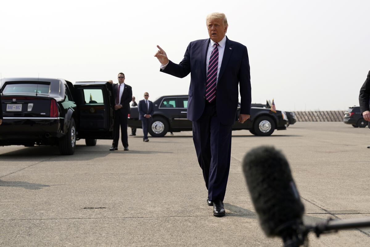 President Trump on the tarmac after arriving at Sacramento McClellan Airport on Monday.