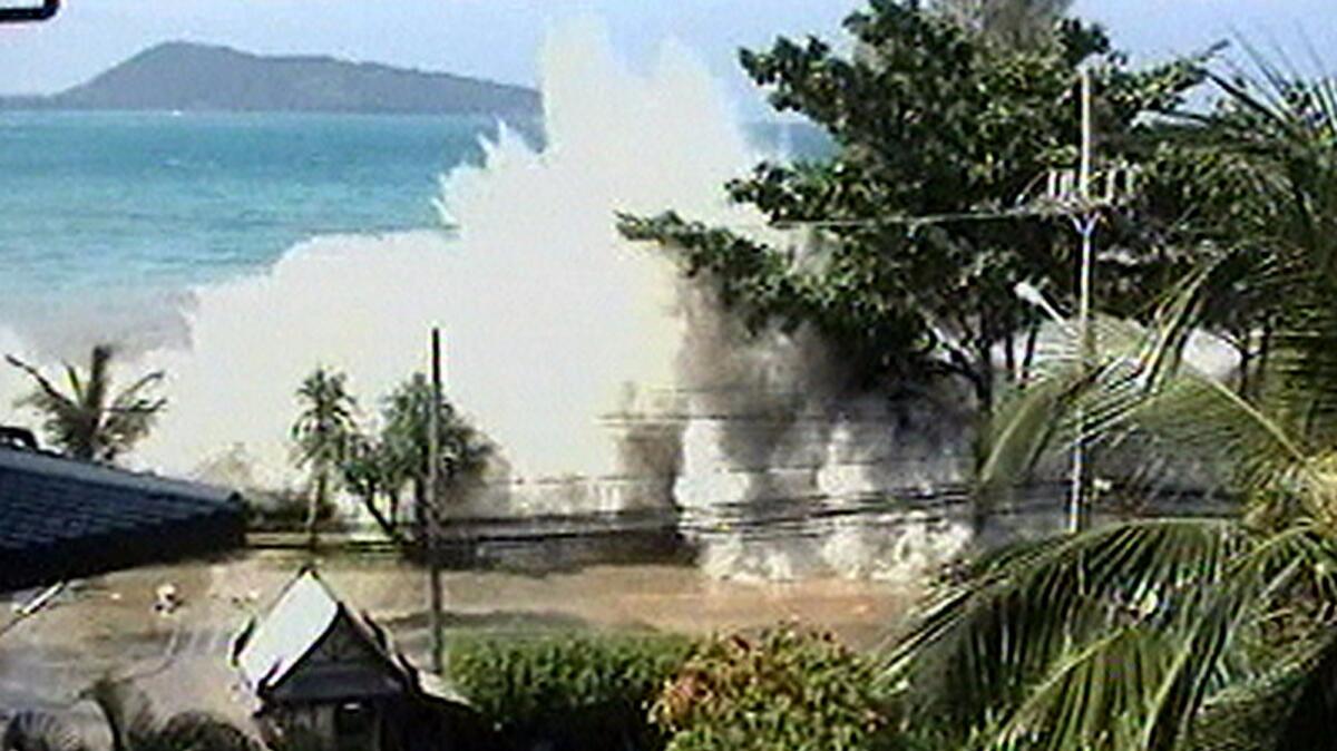 An image made from an amateur video shows a tsunami coming ashore at Thailand's Phuket resort after a magnitude-9.1 earthquake in Indonesia on Dec. 26, 2004.