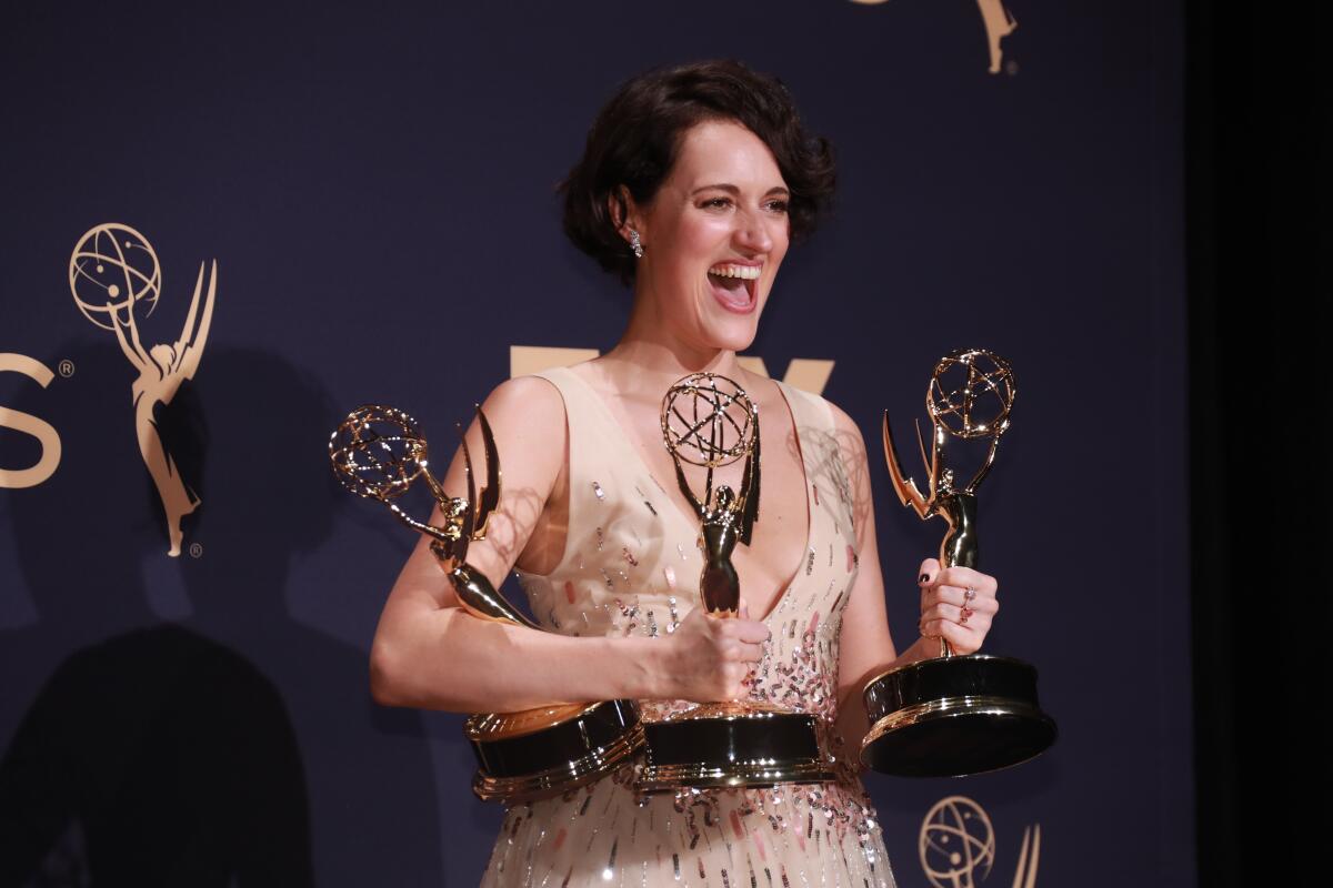 Phoebe Waller-Bridge with the three of the four Emmys awarded to "Fleabag."