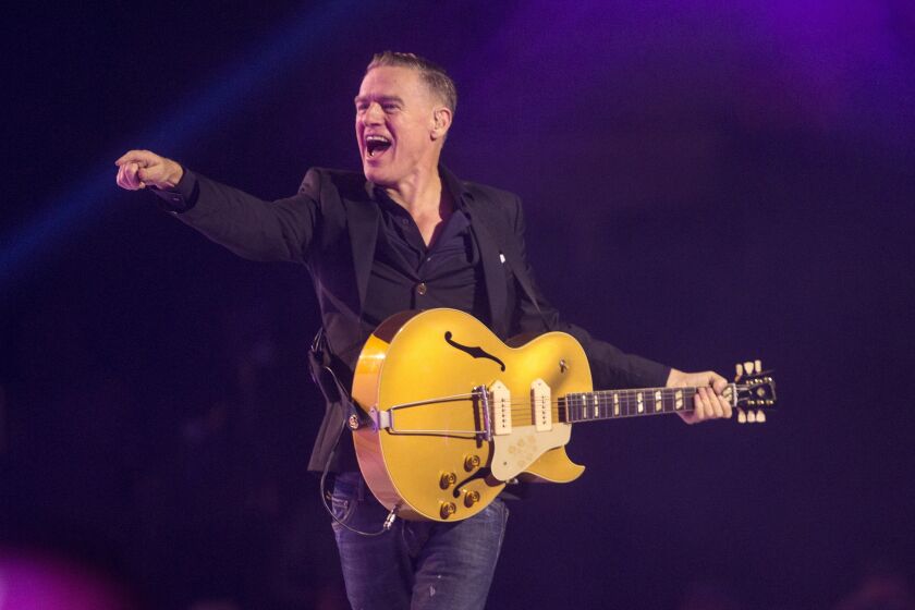 FILE - Bryan Adams performs during the Invictus Games closing ceremony in Toronto, on Sept. 30, 2017. Adams is nominated for a Grammy for best rock performance for “So Happy It Hurts." (Chris Young/The Canadian Press via AP, File)