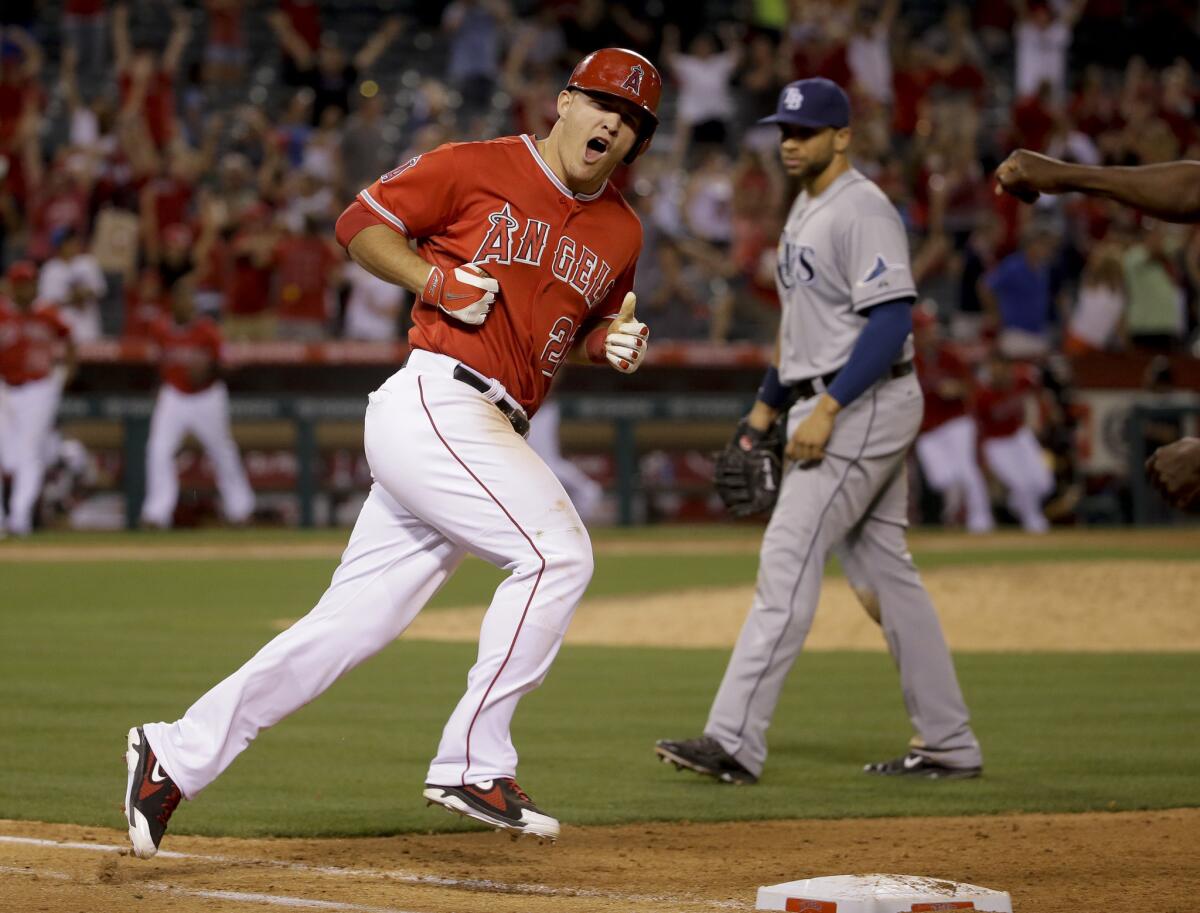 Mike Trout rounds first base after his three-run walk-off home run.