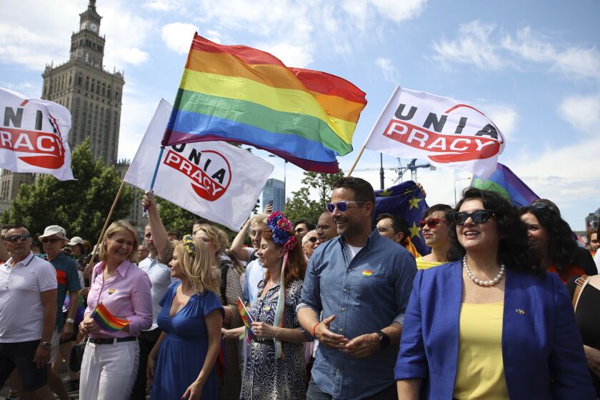 Warsaw's mayor Rafal Trzaskowski, second right, and European Commissioner for Equality, Hanna Dalli, right, take part in the 'Warsaw and Kyiv Pride' marching for freedom in Warsaw, Poland, Saturday, June 25, 2022. Due to Russia's full-scale war against Ukraine the 10th anniversary of the equality march in Kyiv can't take place in the usual format in the Ukrainian capital. The event joined Warsaw's yearly equality parade, the largest gay pride event in central Europe, using it as a platform to keep international attention focused on the Ukrainian struggle for freedom. (AP Photo/Michal Dyjuk)