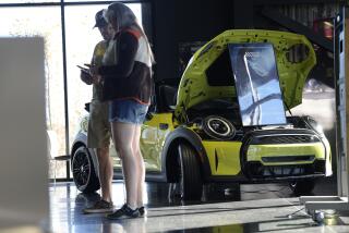 An unsold 2024 Cooper S convertible sits on the floor of a Mini dealership Saturday, Oct. 21, 2023, in Highlands Ranch, Colo. (AP Photo/David Zalubowski)