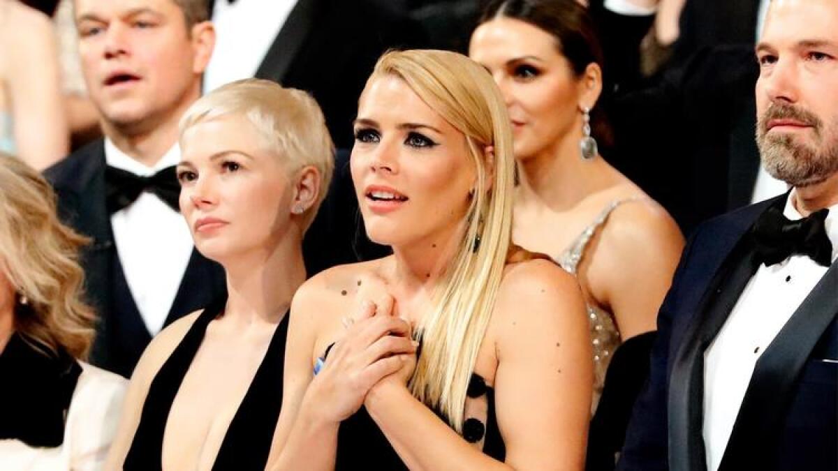 Busy Philipps clutches her perfectly manicured nails as the 'Moonlight' cast and crew give their thank-you speech.