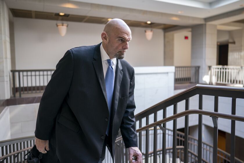 FILE - Sen. John Fetterman, D-Pa., leaves an intelligence briefing on the unknown aerial objects, at the Capitol in Washington, Feb. 14, 2023. A person close to Fetterman says he'll return to the Senate in April, two months after the freshman Democrat sought inpatient treatment for clinical depression. (AP Photo/J. Scott Applewhite)