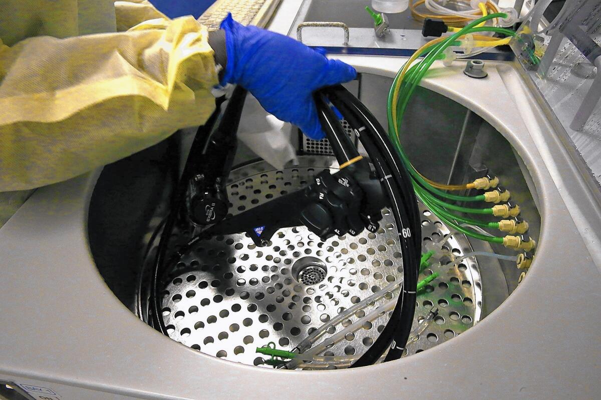 A scope-cleaning machine is used to wash a gastrointestinal device called a duodenoscope at Los Angeles County-USC Medical Center in November.