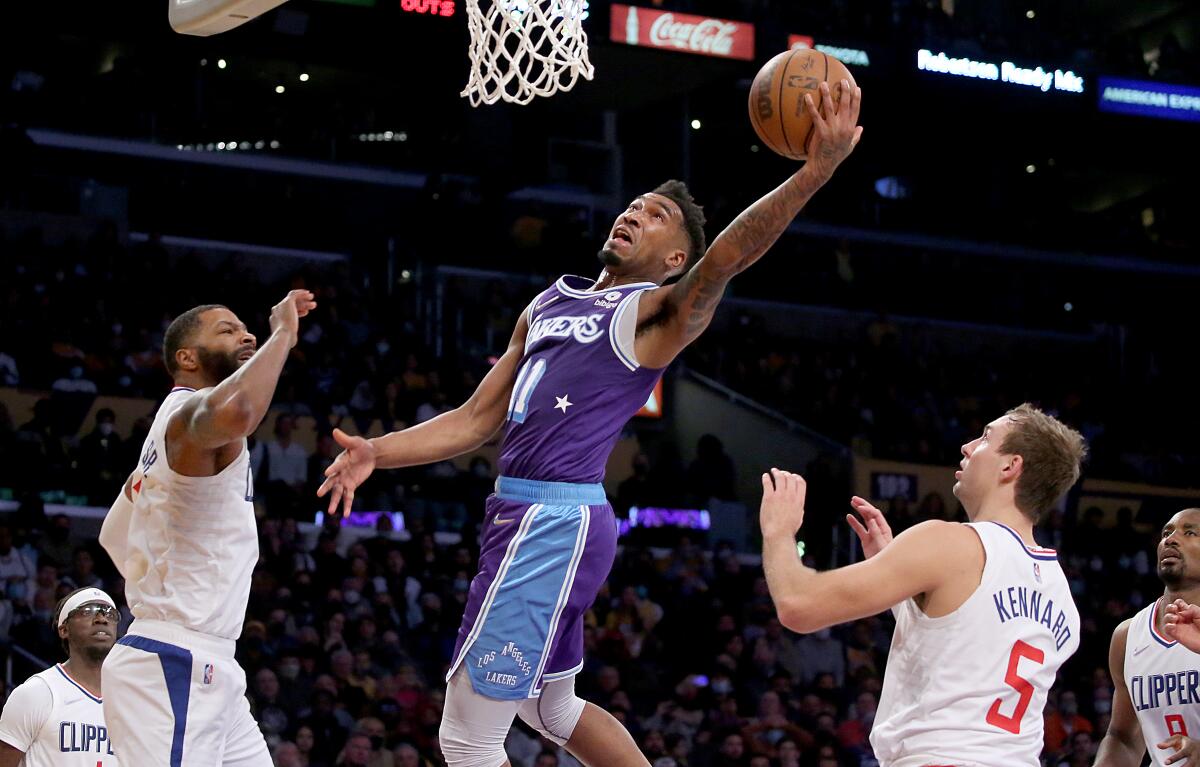 Lakers guard Malik Monk scores against the Clippers.