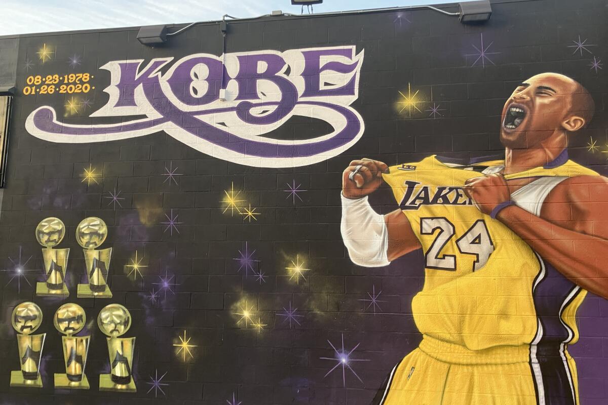 A mural outside Continental 1 Hour Cleaners shows Kobe Bryant tugging on his No. 24 jersey while letting out a roar.