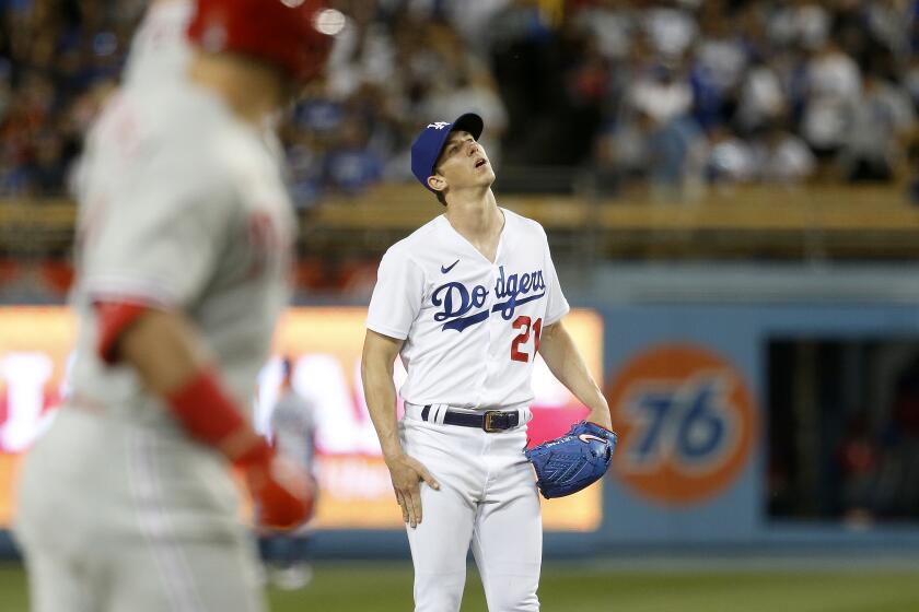 LOS ANGELES, CA - MAY 13: Los Angeles Dodgers starting pitcher Walker Buehler (21) gives up.