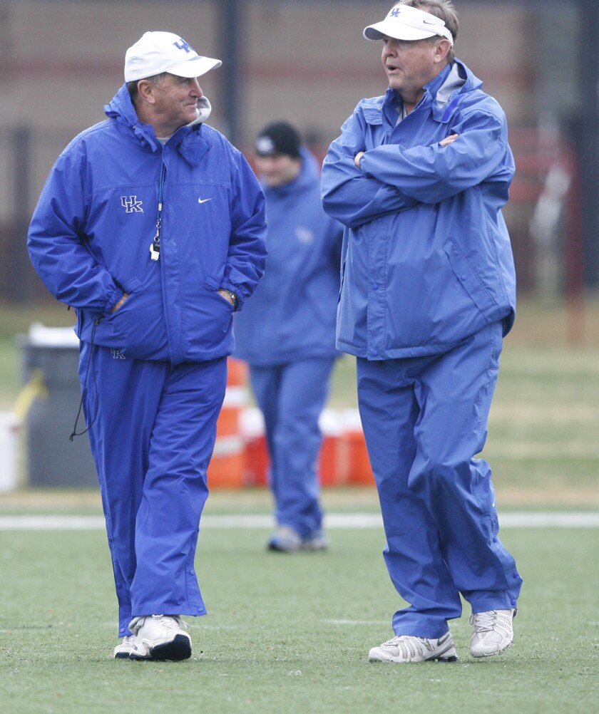 Kentucky coach Rich Brooks (left) and assistant head coach Steve Ortmayer talk during practice for Music City Bowl in 2007.