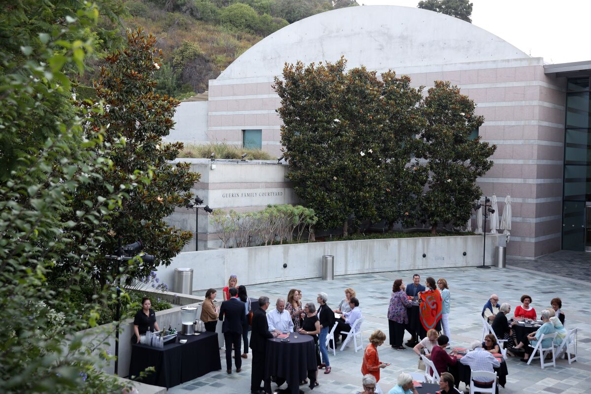 People gather in an outdoor area at the Skirball Cultural Center.