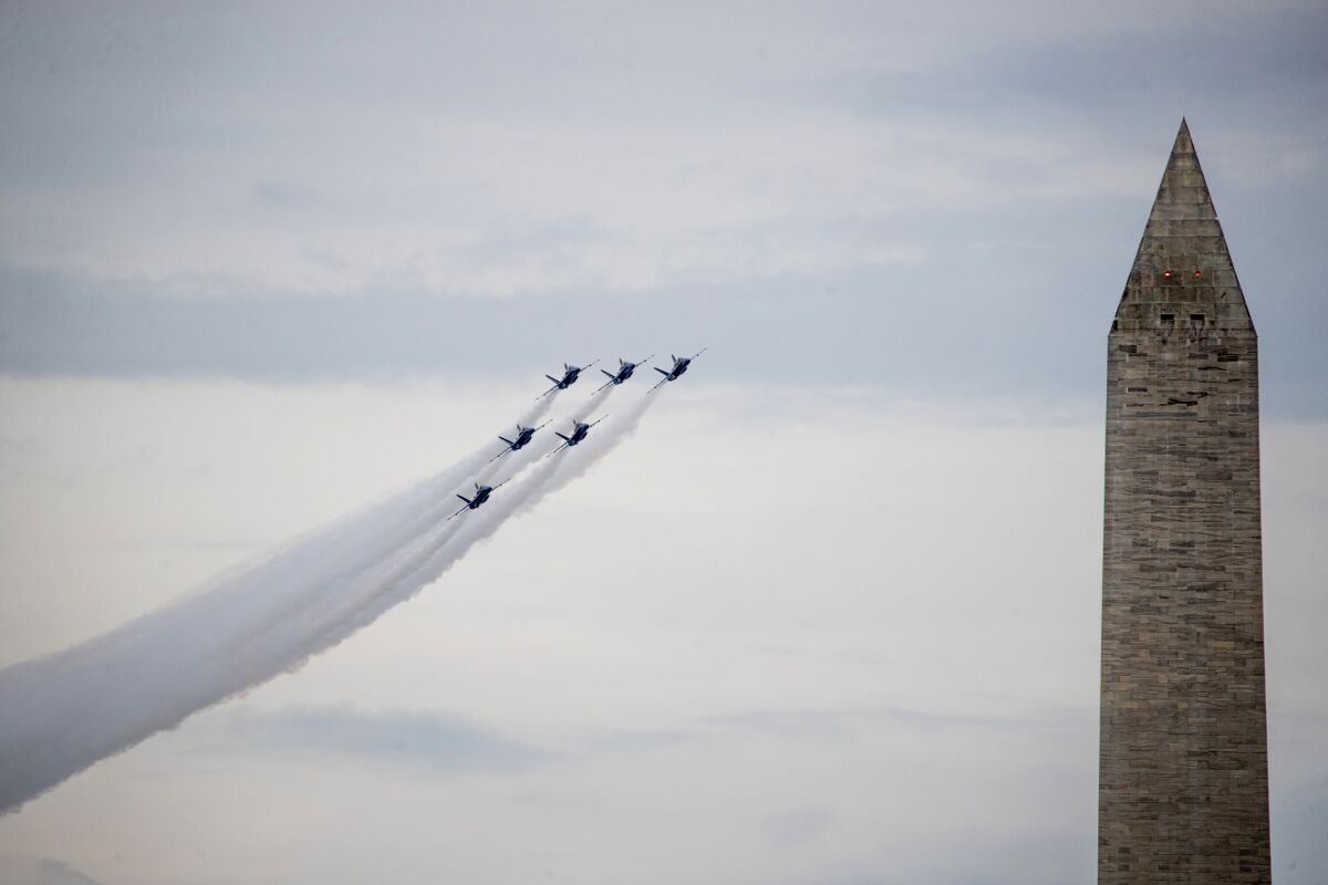 FILE - In this July 4, 2019, file photo, the Washington Monument is visible as the U.S. Navy Blue Angels flyover at the conclusion of President Donald Trump's Independence Day celebration in front of the Lincoln Memorial in Washington. (AP Photo/Andrew Harnik, File)