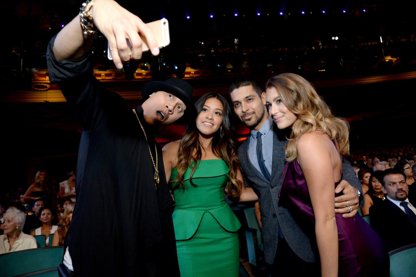 Celebrity selfies | Rapper Taboo, Gina Rodriguez, Wilmer Valderrama, and Alexa PenaVega