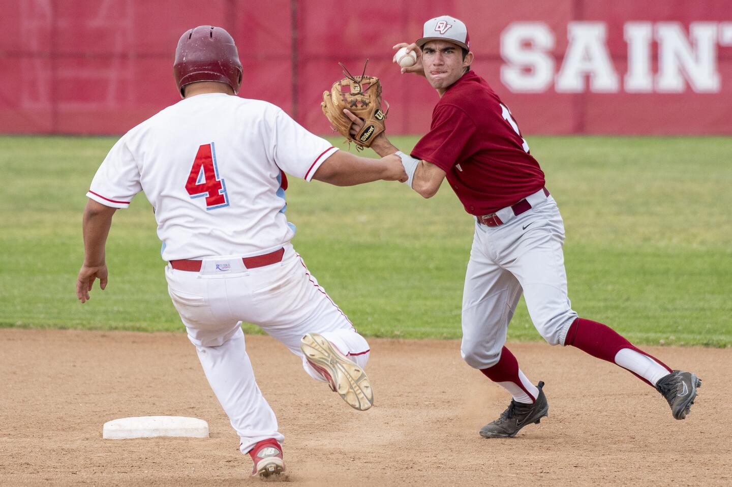 Ocean View's Jake Volo gets the force out against Santa Ana's Adrian Gonzalez and attempts to turn a double paly during a Golden West League game on Tuesday, May 1.