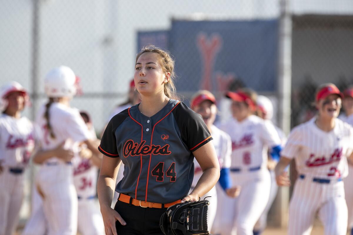 Huntington Beach's Zoe Prystajko walks off the field after losing to Los Alamitos.