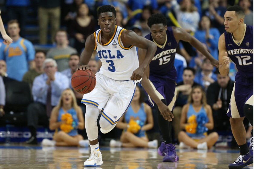 UCLA guard Aaron Holiday streaks up court after stealing the ball from Washington forward Noah Dickerson during the second half of a game at Pauley Pavilion on Jan. 28.