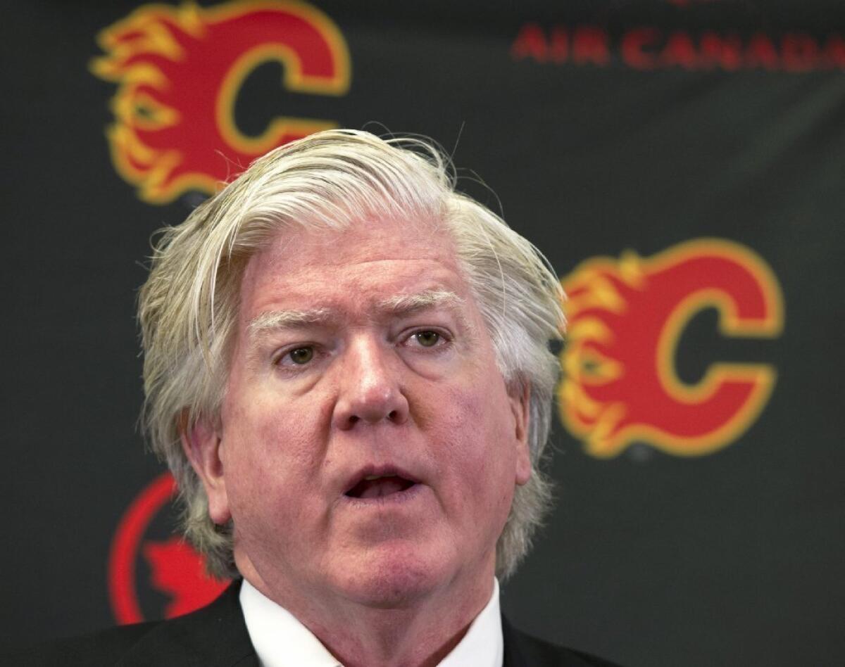 Brian Burke, who arrived on Sept. 5 as the Calgary Flames' president of hockey operations, will take over as acting general manager after dismissing Brian Feaster.