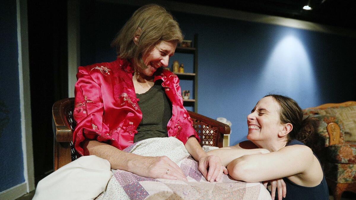 Pamela Shafer, who plays Mary, talks with Jessica Blair, who plays her daugher Austin, as they rehearse a scene for "Sister Cities" at Sidewalk Studio Theatre in Burbank on Monday. The opening show, which is sold out, is this Friday.
