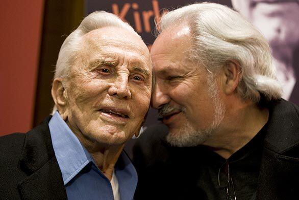 Kirk Douglas, left, with Jeff Kanew, director of "Before I Forget," were at the premiere screening of the movie. It was held at the Writers Guild Theater in Beverly Hills to raise awareness of the Motion Picture & Television Fund.