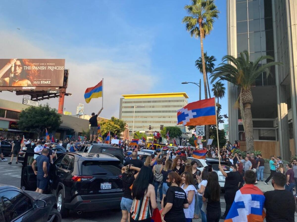Protesters rally Saturday outside the CNN building in Hollywood. Some spilled out to the 101 Freeway.
