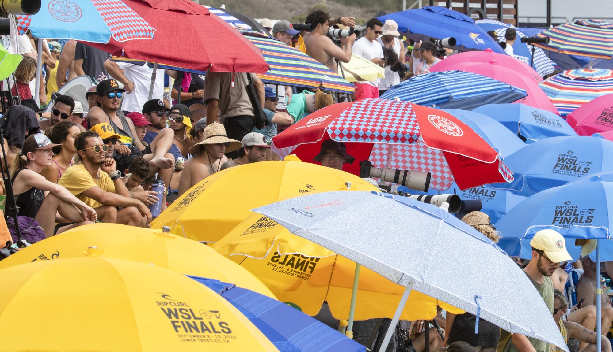 Hundreds of fans line the cobble-stone-lined beach to watch the Rip Curl WSL Finals at Lower Trestles.