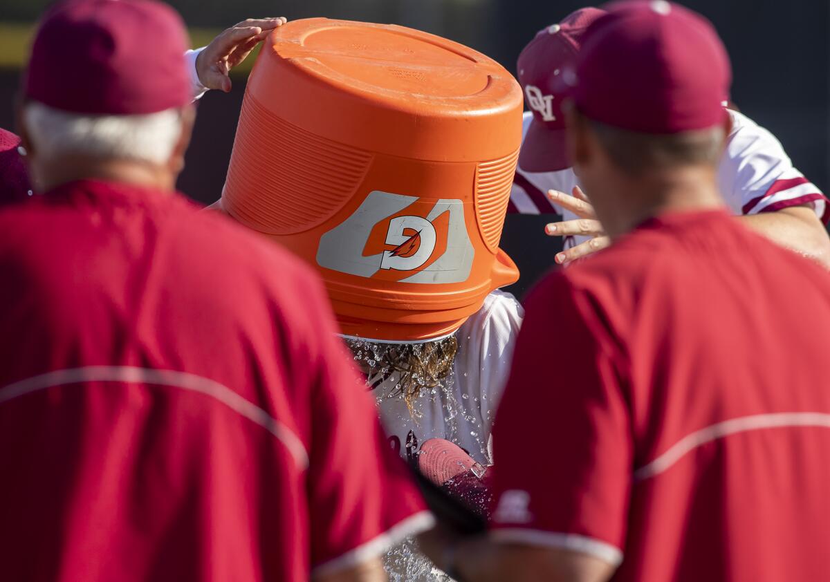 Ocean View's Spencer Johnsen has a jug of water dumped on his head after throwing a no-hitter against Segerstrom on Thursday.