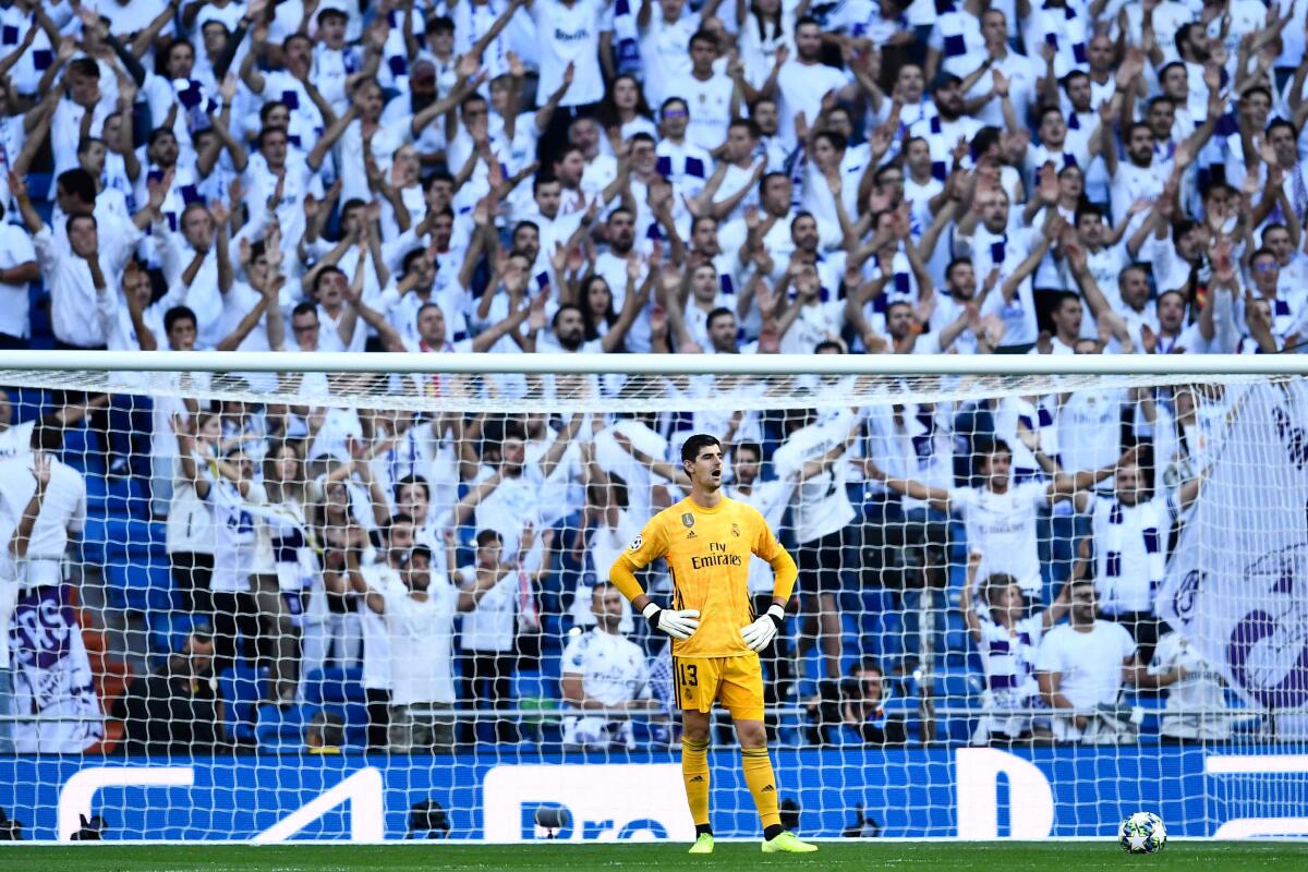 TOPSHOT - Real Madrid's Belgian goalkeeper Thibaut Courtois reacts during the UEFA Champions league Group A football match between Real Madrid and Club Brugge at the Santiago Bernabeu stadium in Madrid on October 1, 2019. (Photo by OSCAR DEL POZO / AFP) (Photo by OSCAR DEL POZO/AFP via Getty Images) ** OUTS - ELSENT, FPG, CM - OUTS * NM, PH, VA if sourced by CT, LA or MoD **