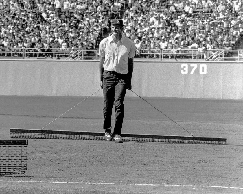 Jerry Reuss drags the infield during a Dodgers game.