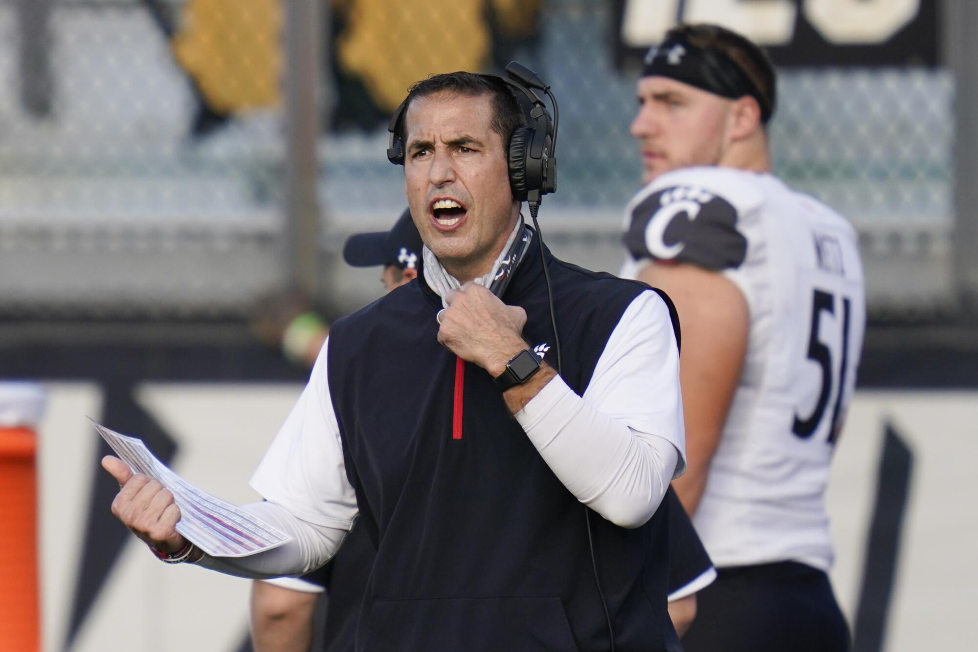 Cincinnati coach Luke Fickell shouts instructions to his players 