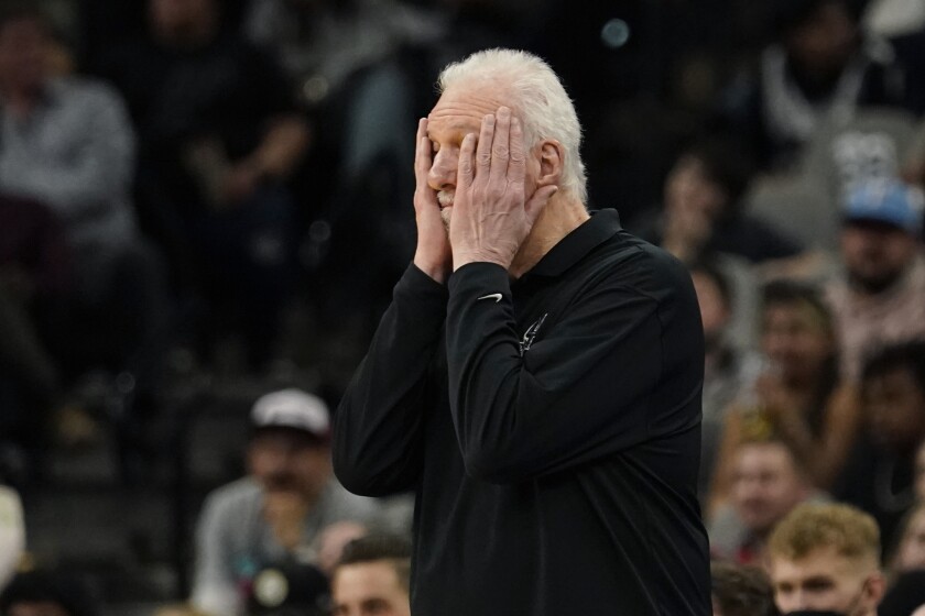 San Antonio Spurs coach Gregg Popovich reacts to a play during the first half of the team's NBA basketball game against the Toronto Raptors, Wednesday, March 9, 2022, in San Antonio. (AP Photo/Eric Gay)
