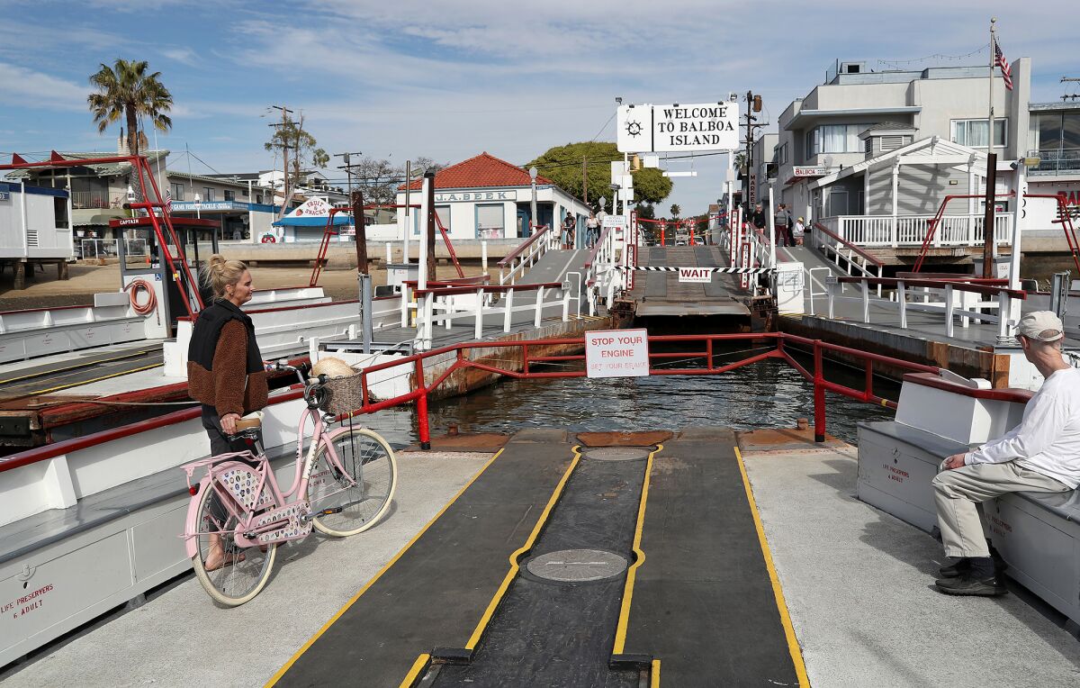 Guests return to Balboa Island on the Balboa Island Ferry in January 2022.