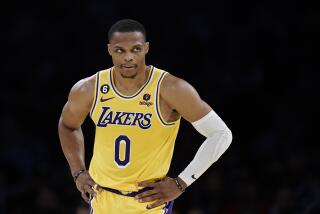 Los Angeles Lakers' Russell Westbrook stands on the court during first half of an NBA preseason basketball game against the Minnesota Timberwolves Wednesday, Oct. 12, 2022, in Los Angeles. (AP Photo/Jae C. Hong)