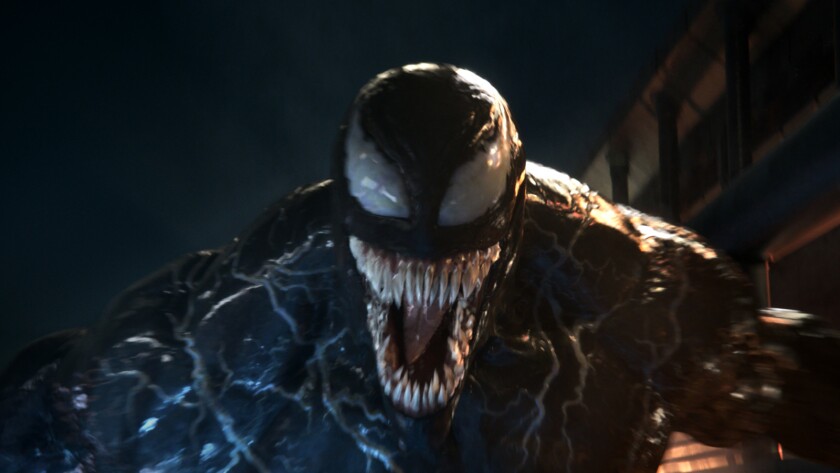 Review Despite Tom Hardy S Alien Parasite Antics Venom Has No Sting Los Angeles Times